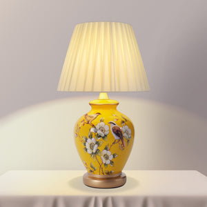 Yellow-Double Bird Chinoiserie Hand-Painted Ceramic Table Lamp table lamp shown lit with warm