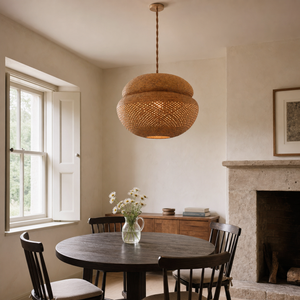 handwoven bulrush - eco-friendly pendant light over a warm kitchen counter