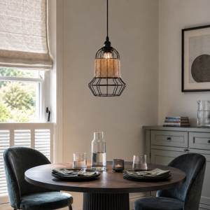 rattan iron basket pendant light above a cozy living room table