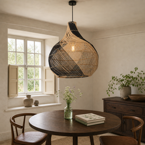 black rattan pendant light over a warm kitchen counter
