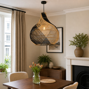 black rattan pendant light beside a bright window