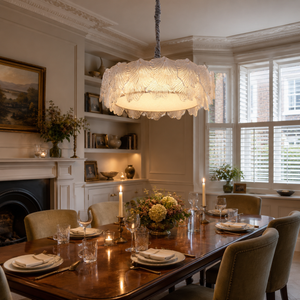 metal glass pendant light above a bright dining table