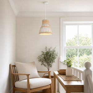 rattan pendant light above a bright dining table