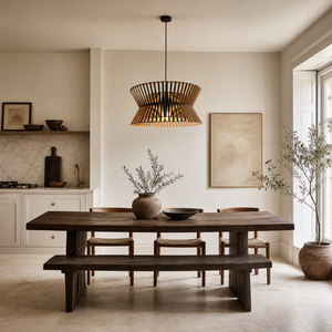 wood drum pendant light beside a bright window