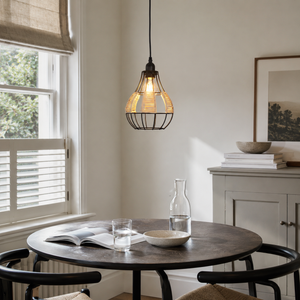 rattan iron pendant light over a warm kitchen counter