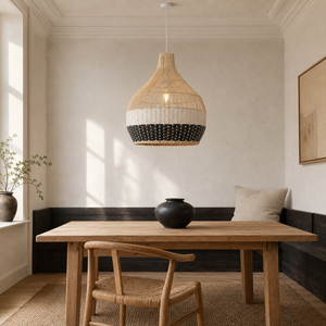 black white rattan pendant light beside a bright window