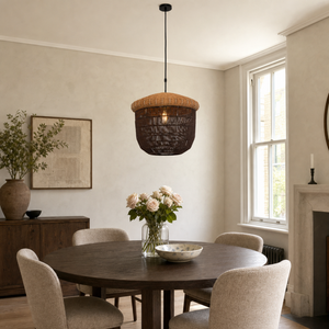 paper rope basket pendant light above a bright dining table