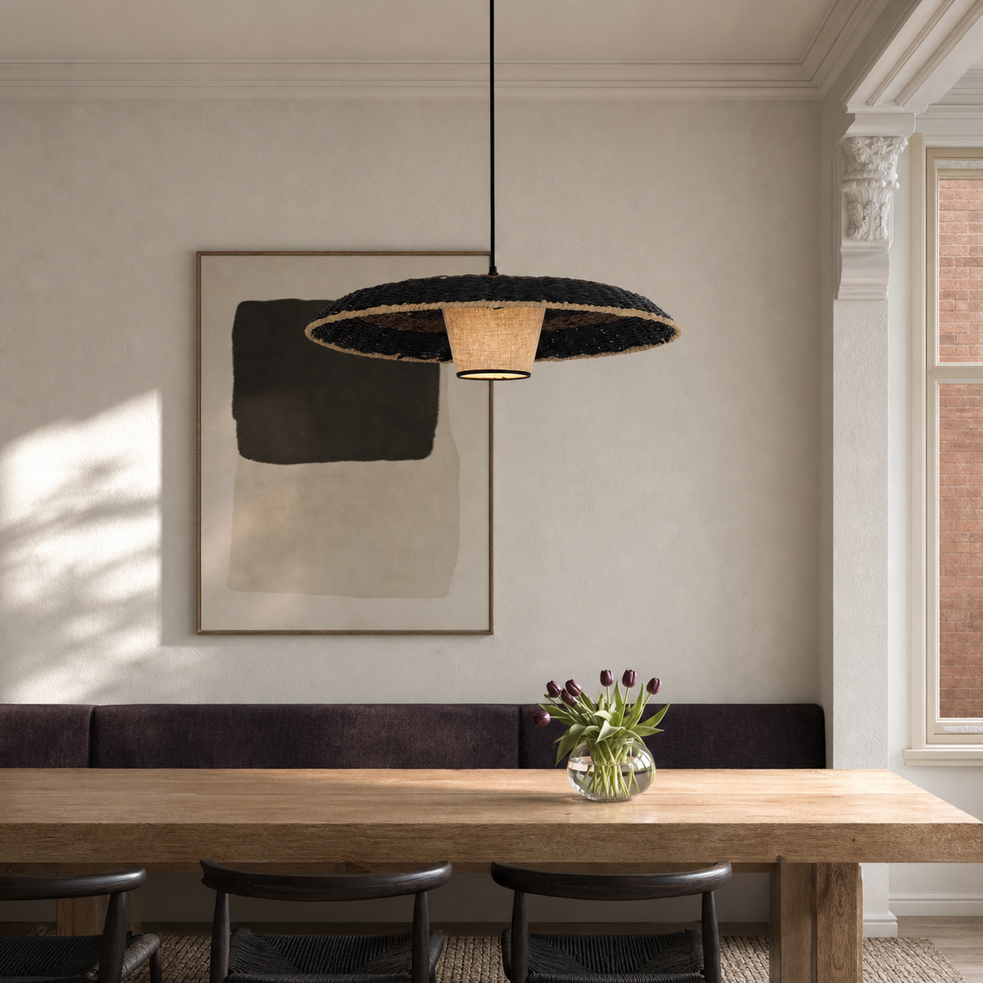 stylish two-tone handwoven stylish pendant light beside a bright window