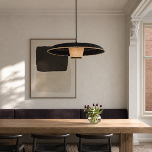 stylish two-tone handwoven stylish pendant light beside a bright window