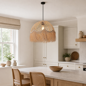 Bohemian rattan dome pendant over a bright kitchen island