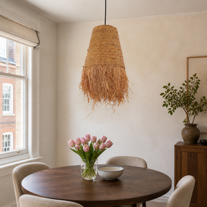 zen wabi-sabi woven grass pendant light above a bright dining table