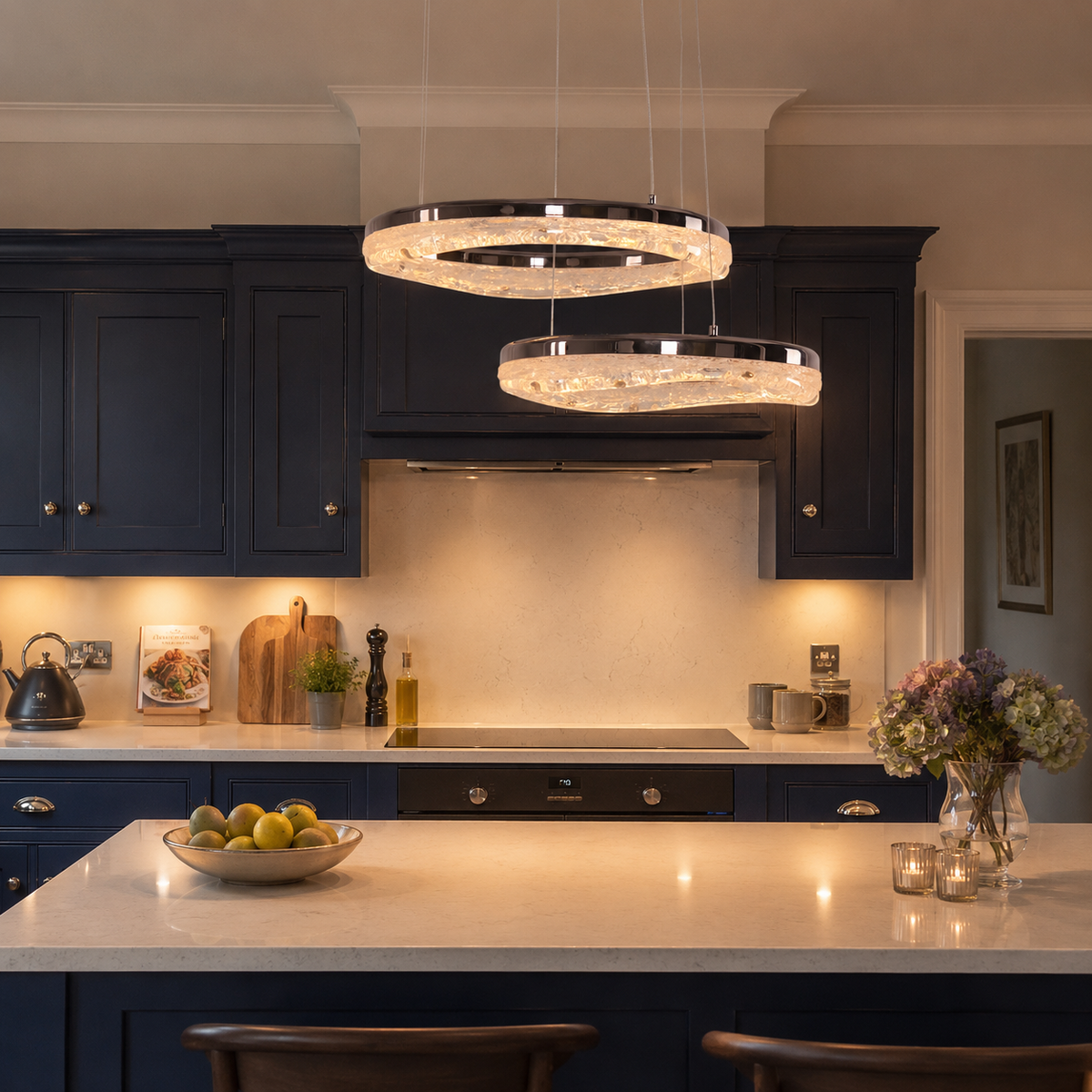 black aluminium wave-detail pendant light over a warm kitchen counter