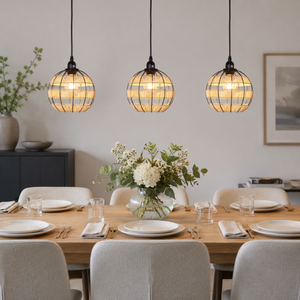 globe pendant light above a cozy living room table