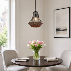 rattan iron pendant light above a bright dining table