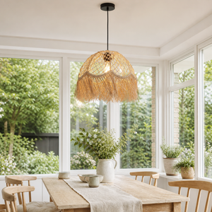 Boho woven pendant with fringe by bright dining room windows