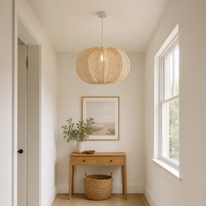 rattan pendant light over a warm kitchen counter