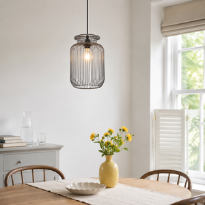 grey iron pendant light beside a bright window