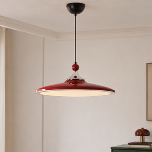 red iron pendant light with red iron shade and warm glow