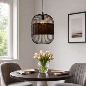 black pendant light above a bright dining table