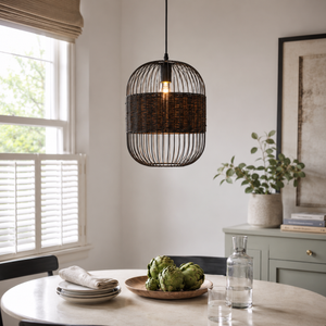 black pendant light beside a bright window