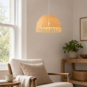 rattan globe pendant light above a bright dining table