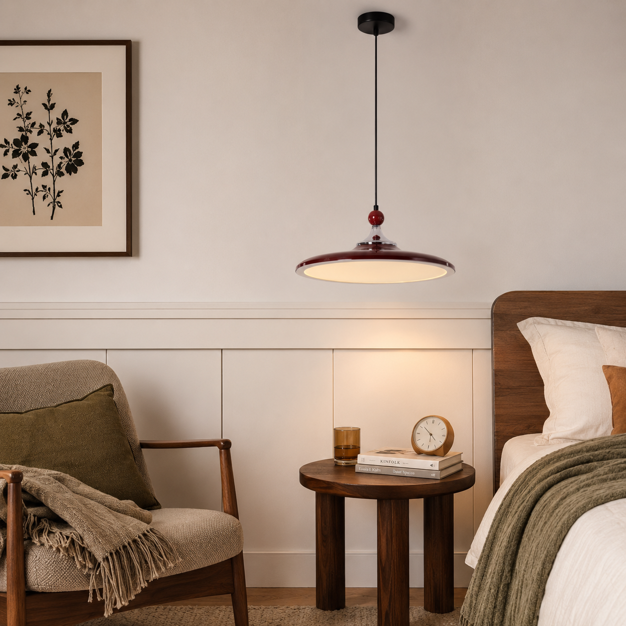 red iron pendant light beside a bed with warm wall decor