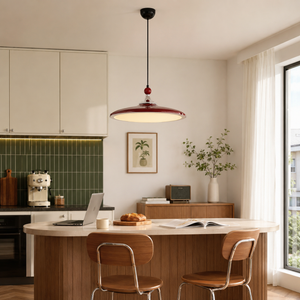 red iron pendant light above a kitchen dining table
