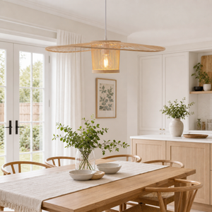 Wide bamboo fan pendant above a warm dining table