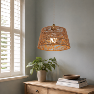 paper rope pendant light above a cozy living room table