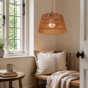 paper rope pendant light over a wooden dining table