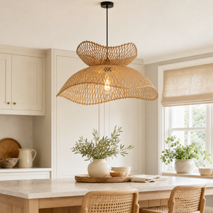Handwoven bamboo flower pendant over a bright kitchen table