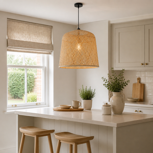 Warm cylindrical bamboo pendant over a round dining table