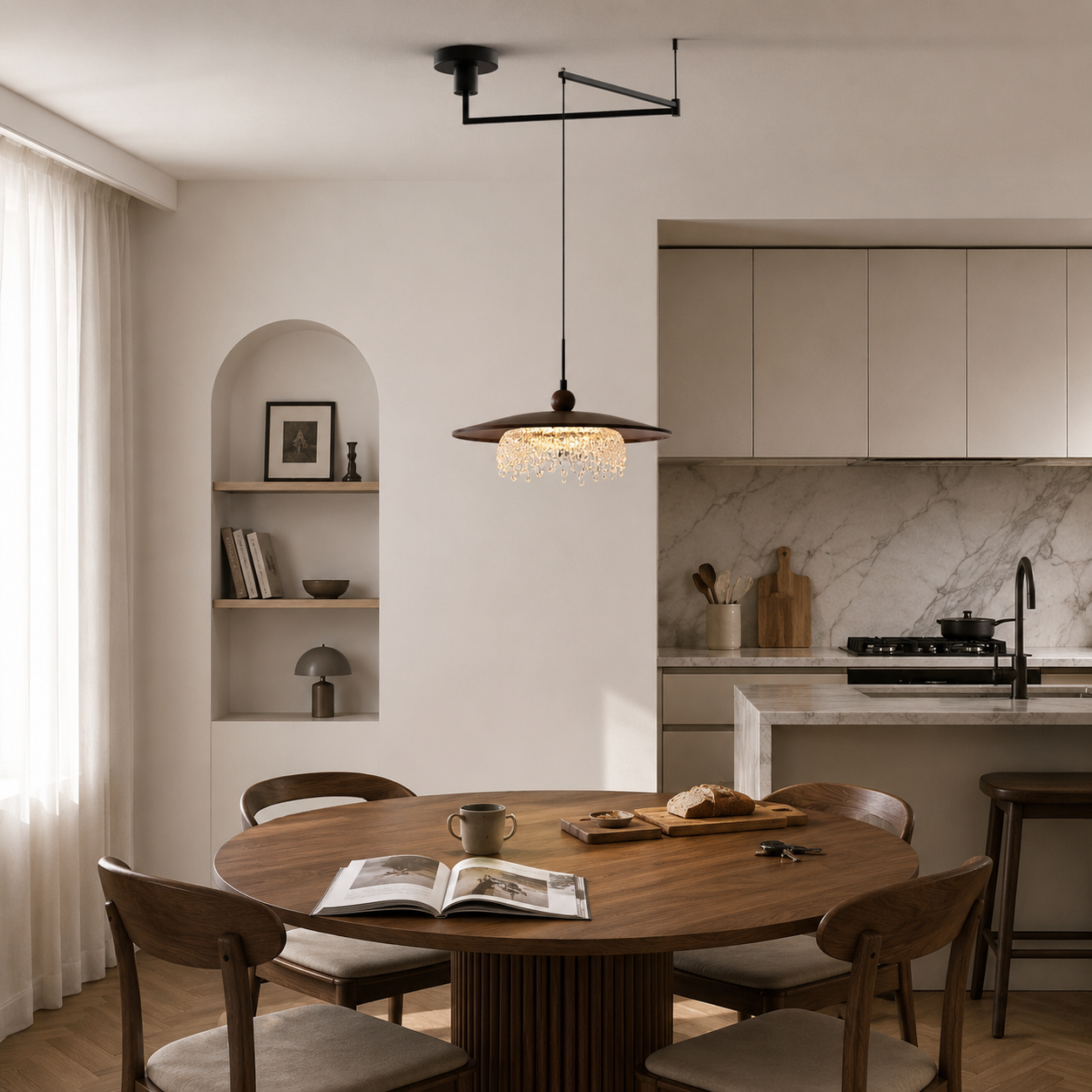 walnut folding acrylic pendant light above a dining table near a kitchen