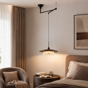 walnut folding acrylic pendant light beside a cosy living room chair