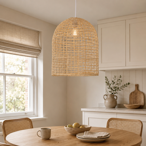 Natural cage-shaped rattan pendant above a kitchen table
