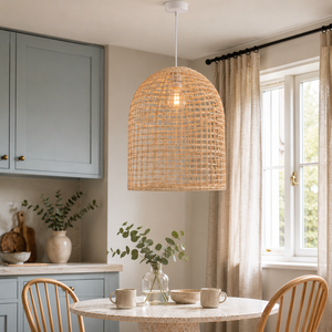 Handwoven rattan cage pendant in a bright dining nook