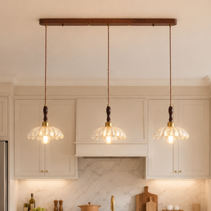 3-light walnut resin mini pendant light set of three walnut resin mini pendants over a kitchen counter