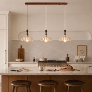 3-light walnut resin mini pendant light above a modern kitchen island with stools