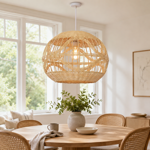 Spherical rattan pendant with wave details above a dining table