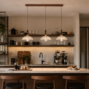 3-light walnut resin mini pendant light above a cafe-style counter