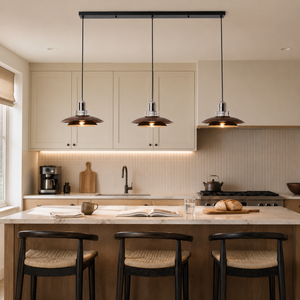 3-light walnut iron pendant light above a kitchen island with bar stools