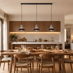 3-light walnut iron pendant light above a dining table in an open kitchen