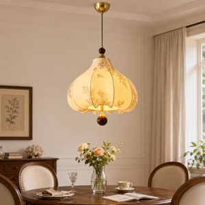 yellow floral fabric pendant light above a round dining table