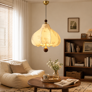 yellow floral fabric pendant light above a living room coffee table