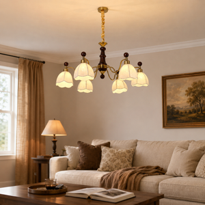 6-light yellow fabric chandelier above a cosy living room sofa