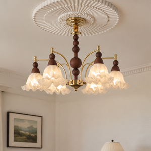 6-light white glass chandelier with white glass shades and gold frame