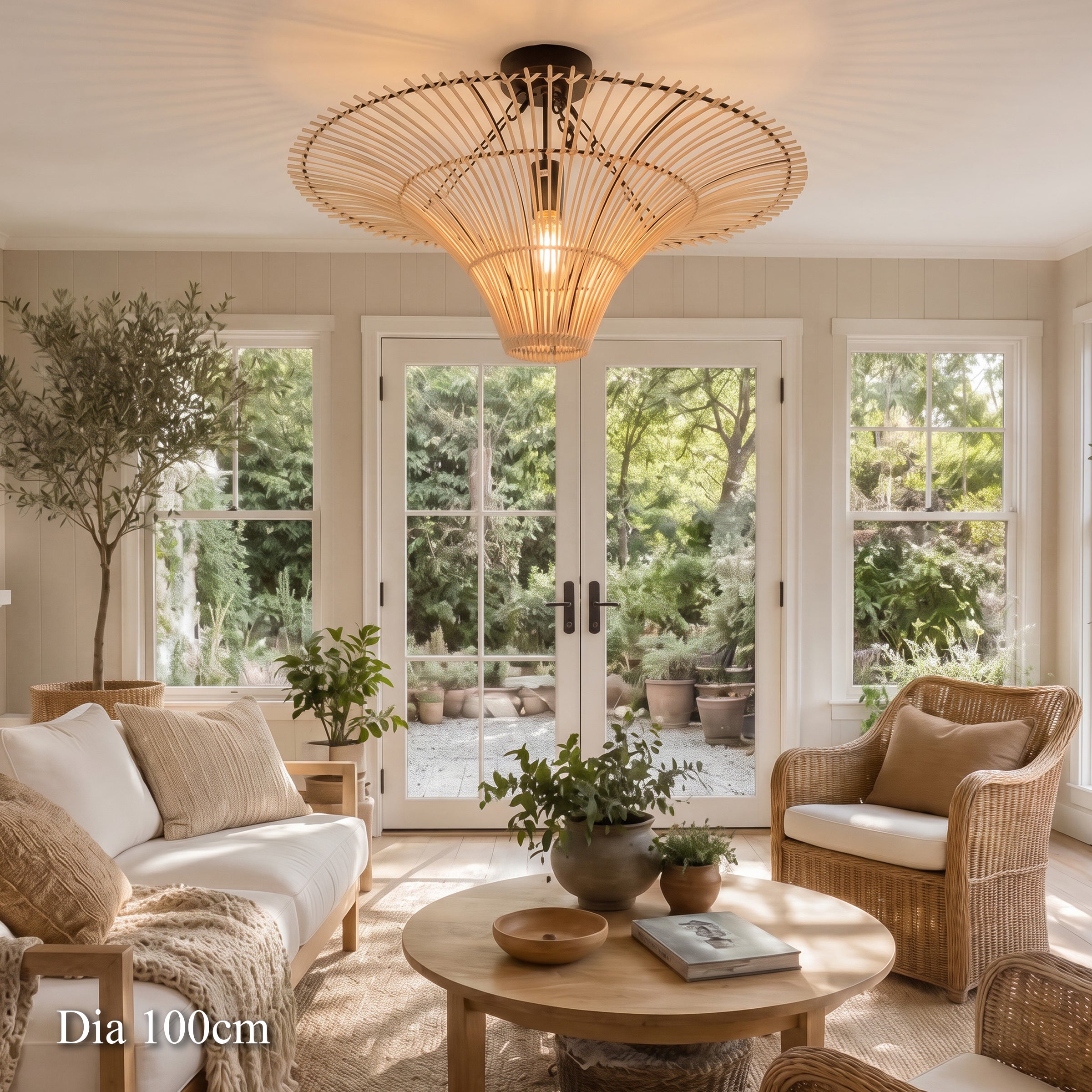 100cm rattan saucer ceiling light above a sunlit lounge with armchairs