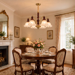 6-light chandelier with white glass shades brightening a traditional dining room