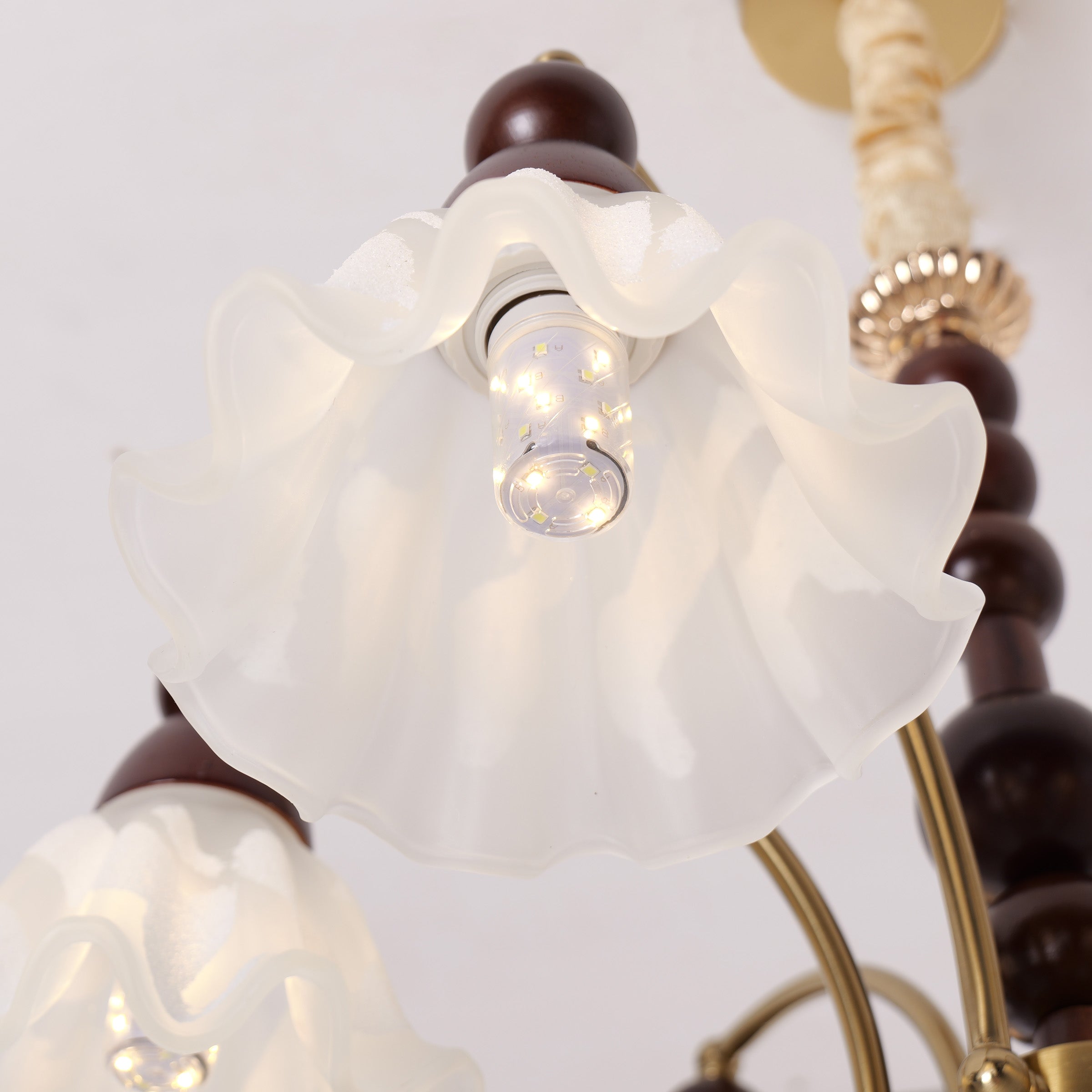 6-light chandelier with white glass shades shown as a clean product view
