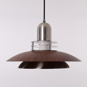 3-light walnut iron bar pendant styled in a calm bedroom